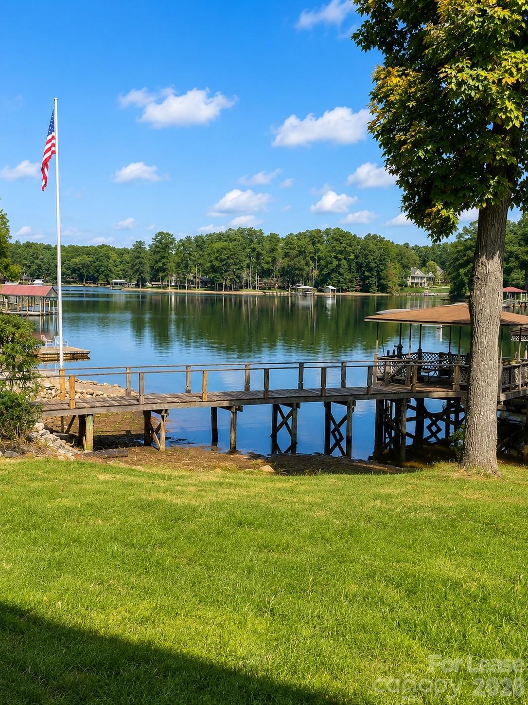 178 Lakeland Road Mooresville, NC 28117 - Photo 1 of 7 a view of a lake with houses