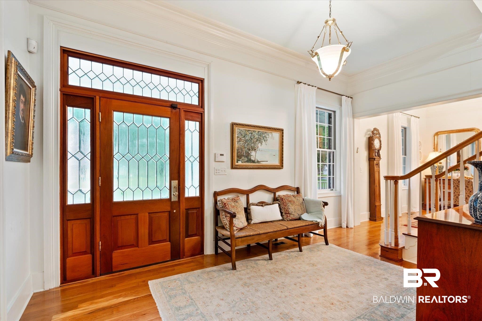 6458 Raintree Road Fairhope, AL 36532 - Photo 4 of 65 Foyer with hardwood / wood-style flooring and crown molding