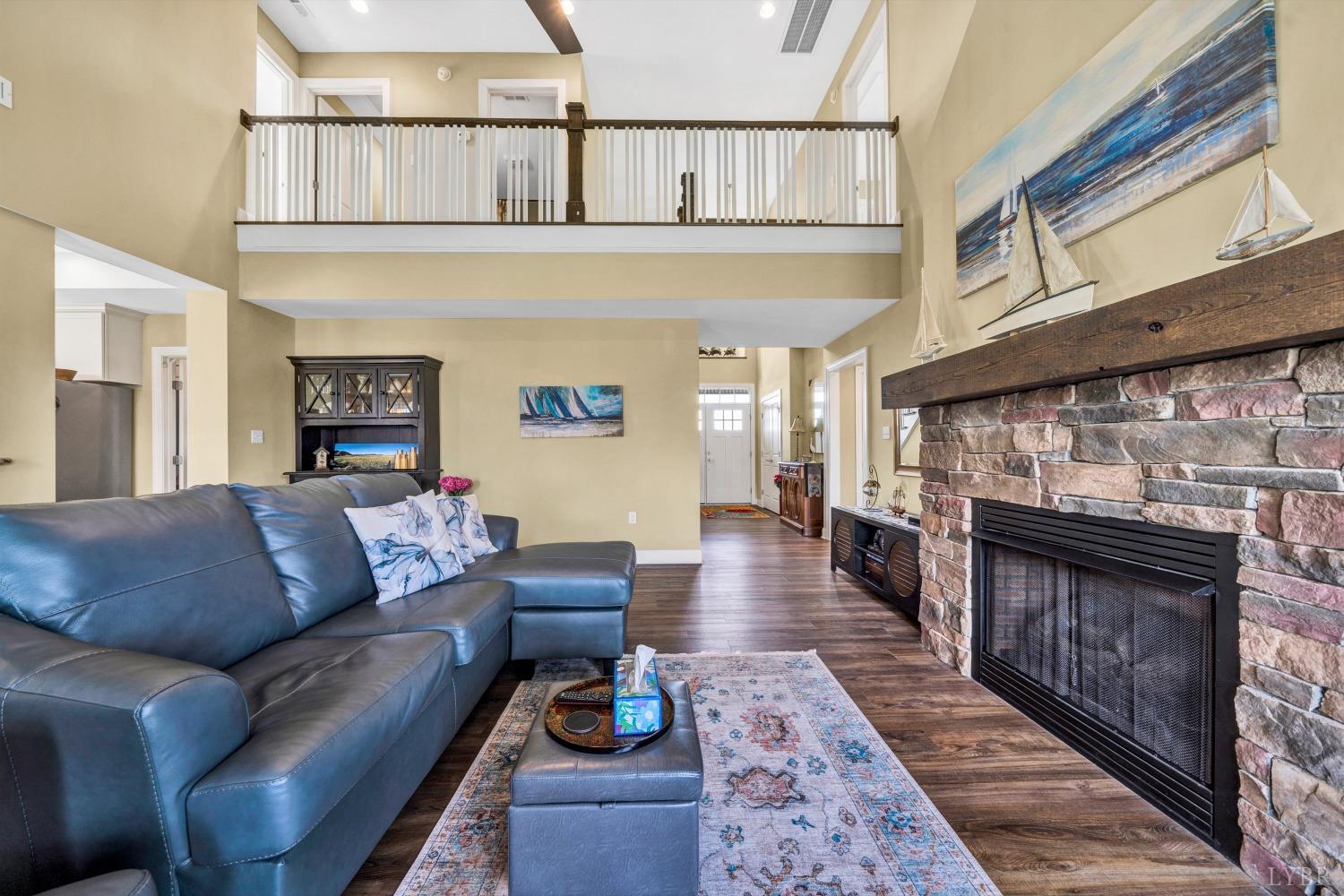 1333 Lynbrook Road Rustburg, VA 24588 - Photo 12 of 53 a living room with furniture a fireplace and a rug