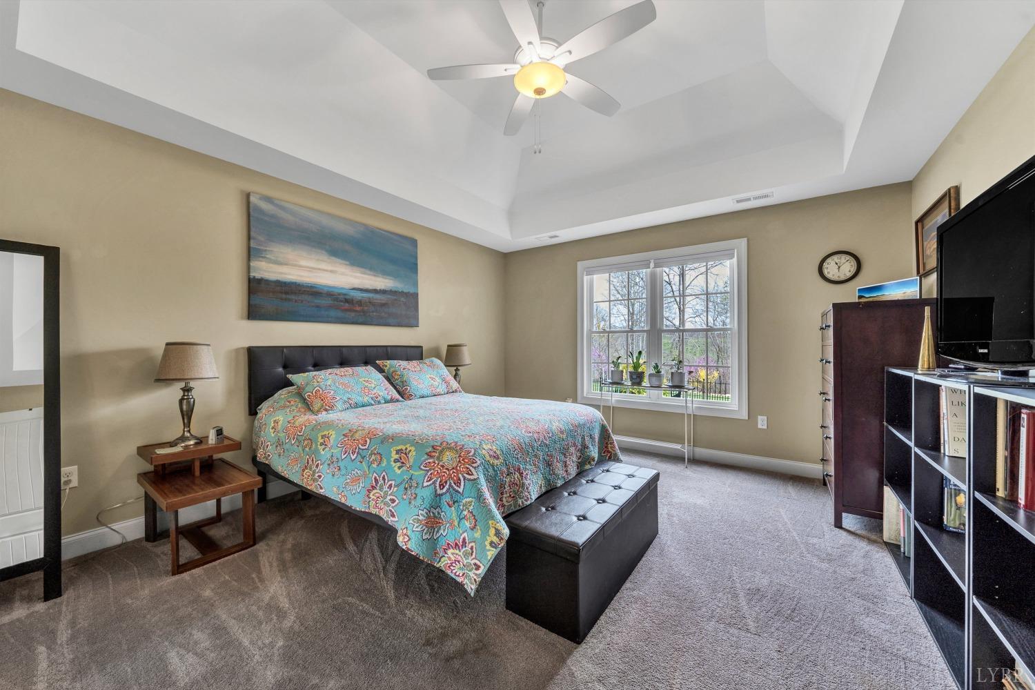 1333 Lynbrook Road Rustburg, VA 24588 - Photo 27 of 53 a bedroom with a bed furniture a flat screen tv and a window