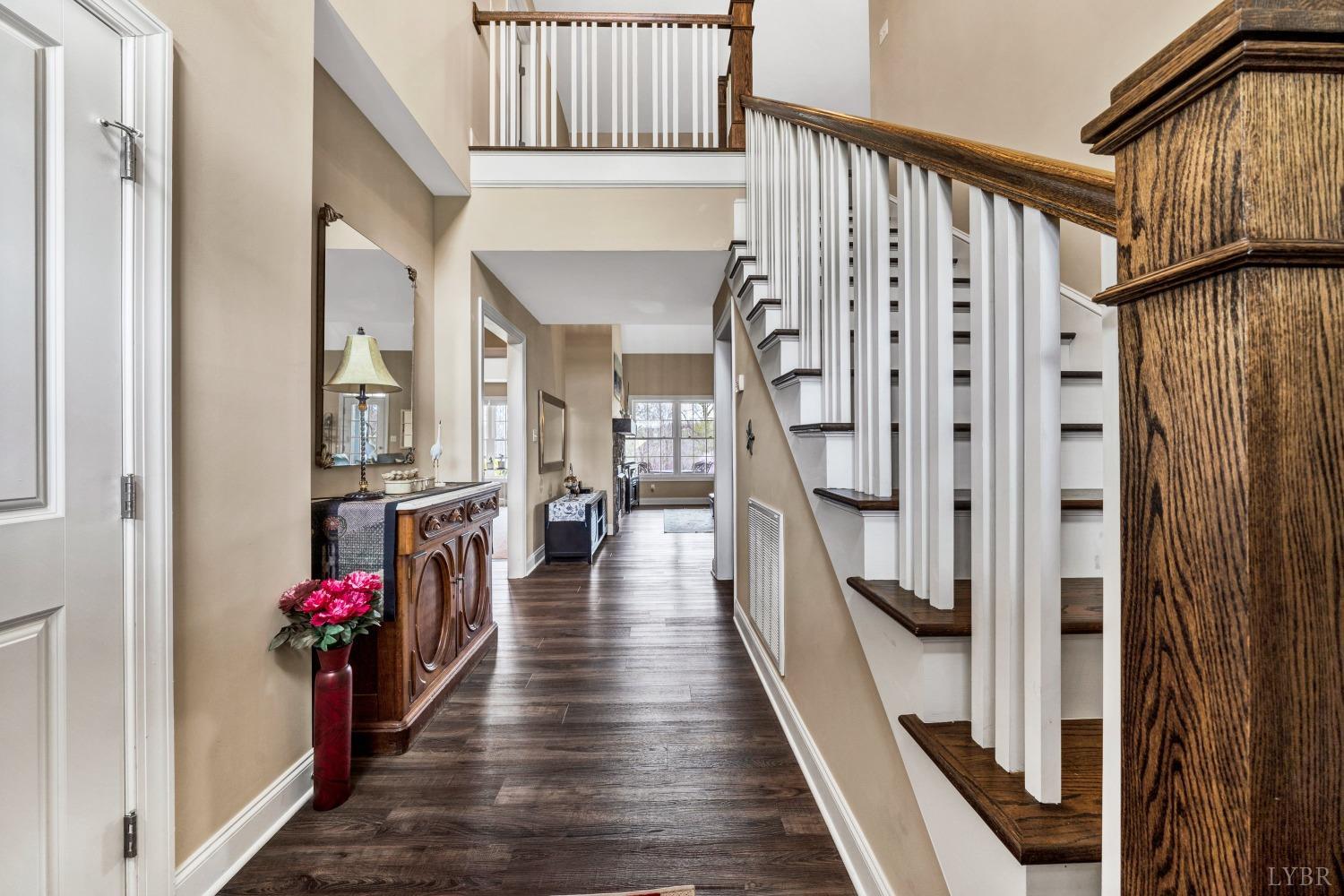 1333 Lynbrook Road Rustburg, VA 24588 - Photo 5 of 53 a view of a hallway with wooden floor and staircase