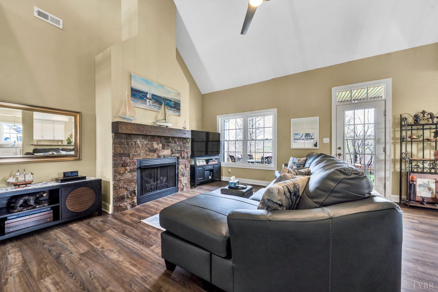 1333 Lynbrook Road Rustburg, VA 24588 - Photo 7 of 53 a living room with furniture and a fireplace