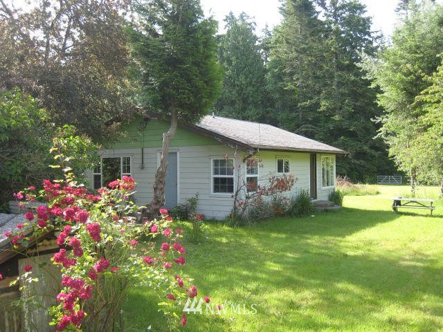 2225 Olson Road Point Roberts, WA 98281 - Photo 1 of 1 a view of a house with a yard and sitting area