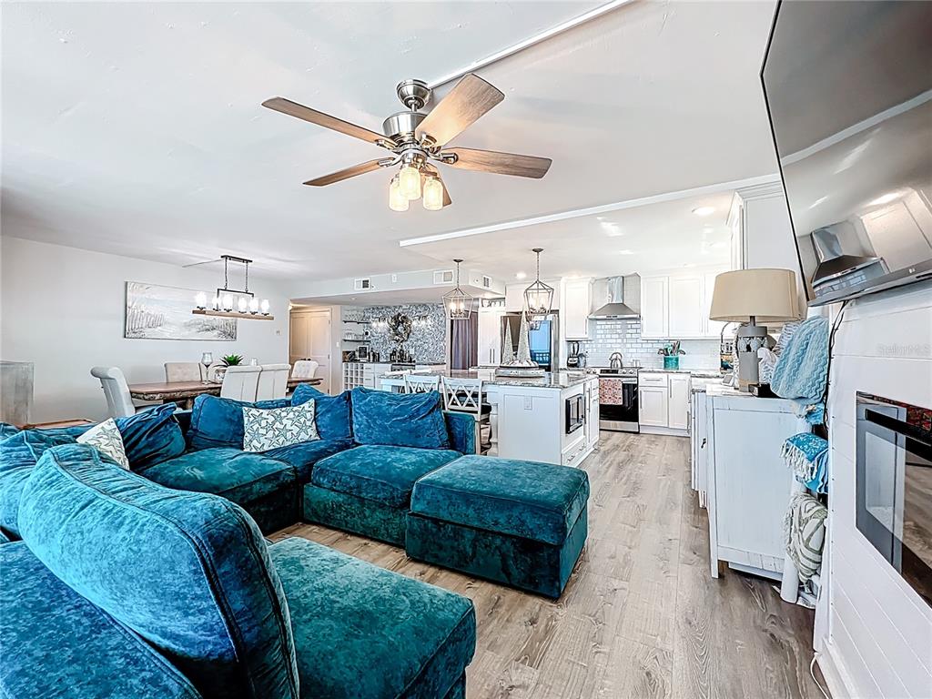 14146 Gulf Boulevard, Unit 3A Madeira Beach, FL 33708 - Photo 11 of 29 a living room with furniture and a view of kitchen