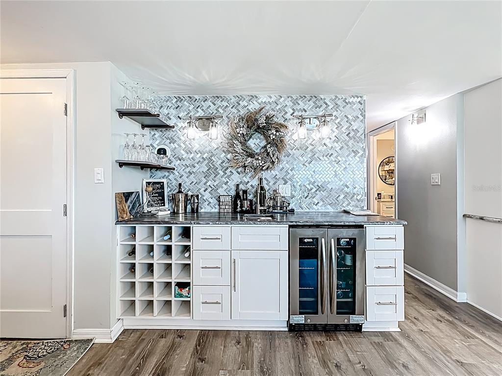 14146 Gulf Boulevard, Unit 3A Madeira Beach, FL 33708 - Photo 13 of 29 walk in closet with wooden floor