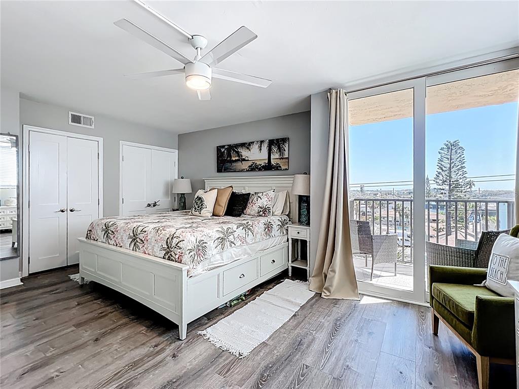 14146 Gulf Boulevard, Unit 3A Madeira Beach, FL 33708 - Photo 15 of 29 a bedroom with a large bed and a large window