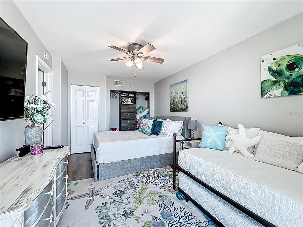 14146 Gulf Boulevard, Unit 3A Madeira Beach, FL 33708 - Photo 23 of 29 a living room with furniture and a chandelier