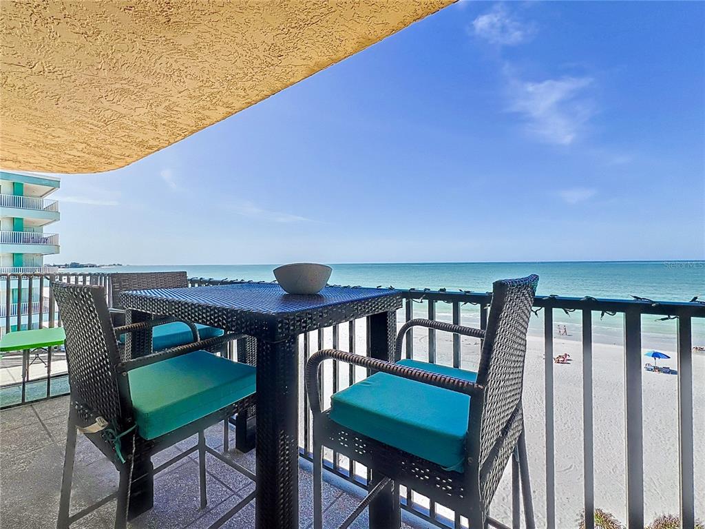 14146 Gulf Boulevard, Unit 3A Madeira Beach, FL 33708 - Photo 4 of 29 a view of a balcony with chairs