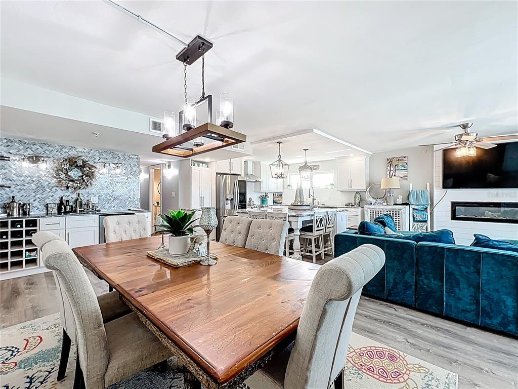 14146 Gulf Boulevard, Unit 3A Madeira Beach, FL 33708 - Photo 7 of 29 a view of a dining room with furniture window and wooden floor