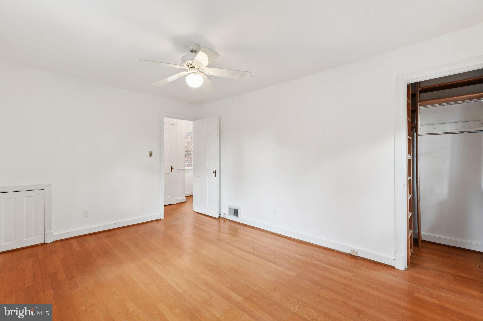 5008 44th Street Northwest Washington, DC 20016 - Photo 13 of 26 a view of an empty room with wooden floor