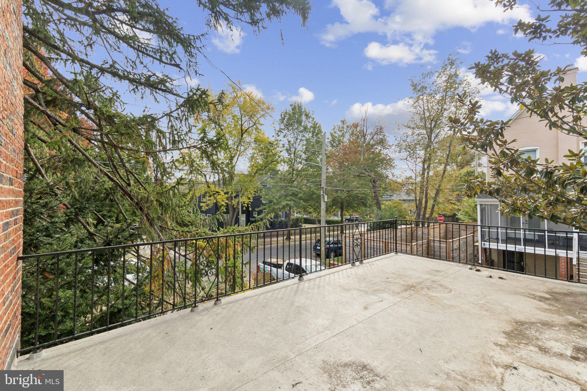 5008 44th Street Northwest Washington, DC 20016 - Photo 22 of 26 a view of a fence and trees from a terrace