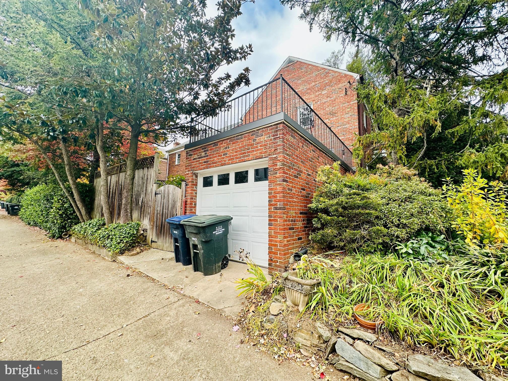 5008 44th Street Northwest Washington, DC 20016 - Photo 26 of 26 a backyard of a house with fountain table and chairs