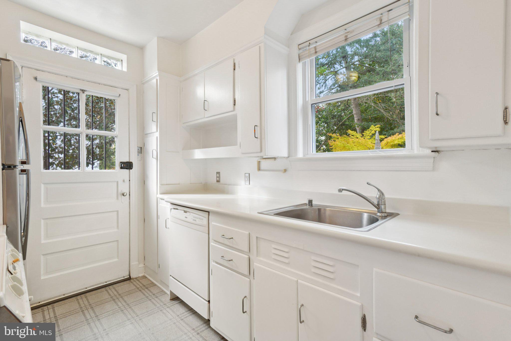5008 44th Street Northwest Washington, DC 20016 - Photo 7 of 26 a bathroom with a sink and a window