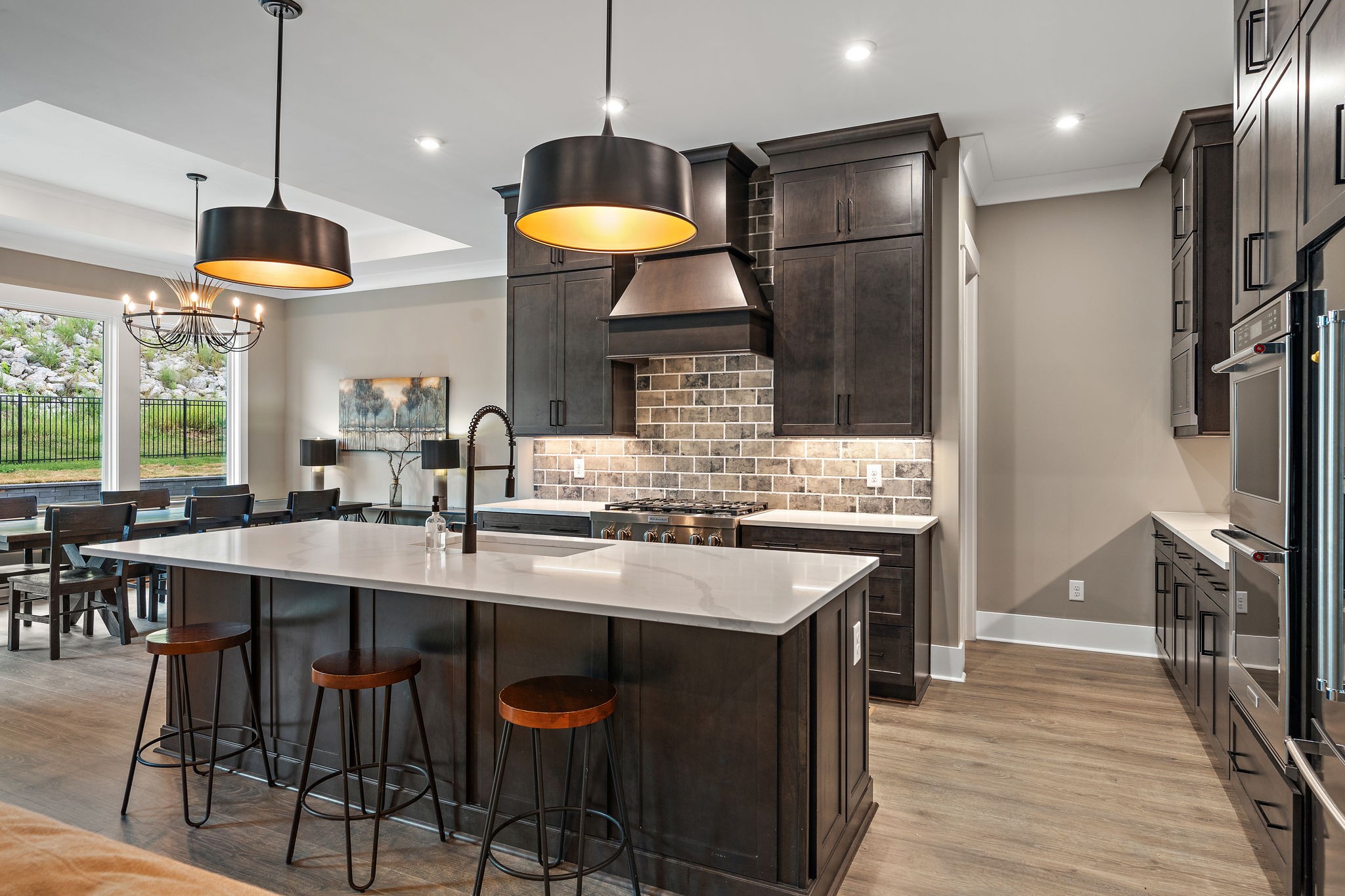 7276 Murrel Drive Franklin, TN 37064 - Photo 11 of 62 a kitchen with stainless steel appliances granite countertop a sink a stove and a refrigerator