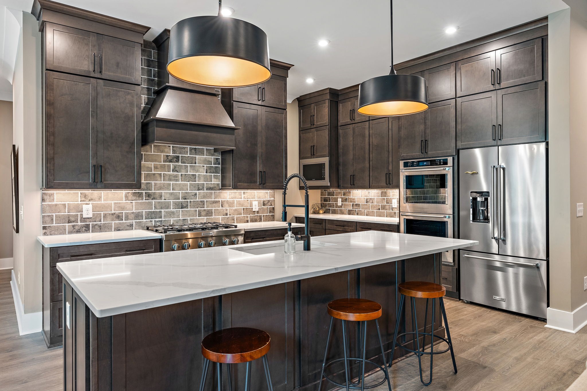 7276 Murrel Drive Franklin, TN 37064 - Photo 12 of 62 a kitchen with stainless steel appliances granite countertop a sink and a refrigerator