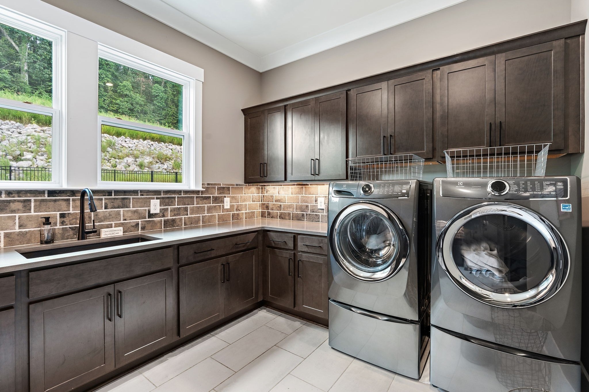 7276 Murrel Drive Franklin, TN 37064 - Photo 23 of 62 a view of a kitchen with sink washer and dryer