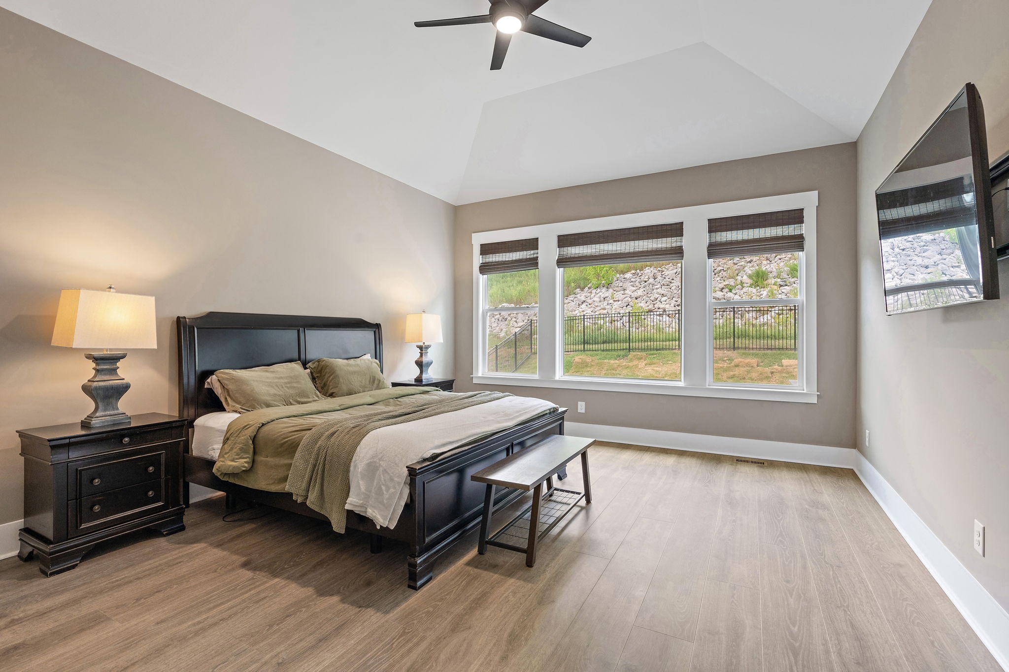 7276 Murrel Drive Franklin, TN 37064 - Photo 30 of 62 a bedroom with a bed a couch and a large window