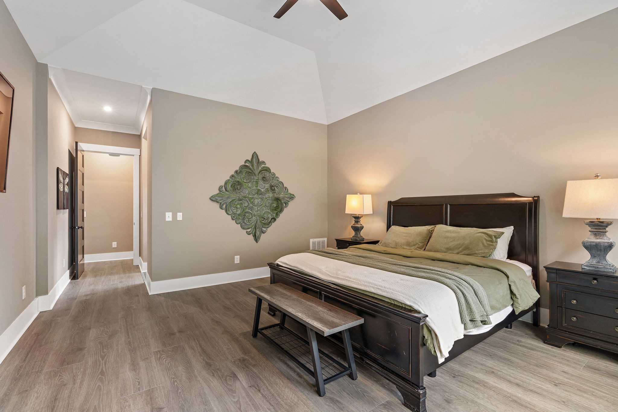 7276 Murrel Drive Franklin, TN 37064 - Photo 32 of 62 a bedroom with a bed and wooden floor