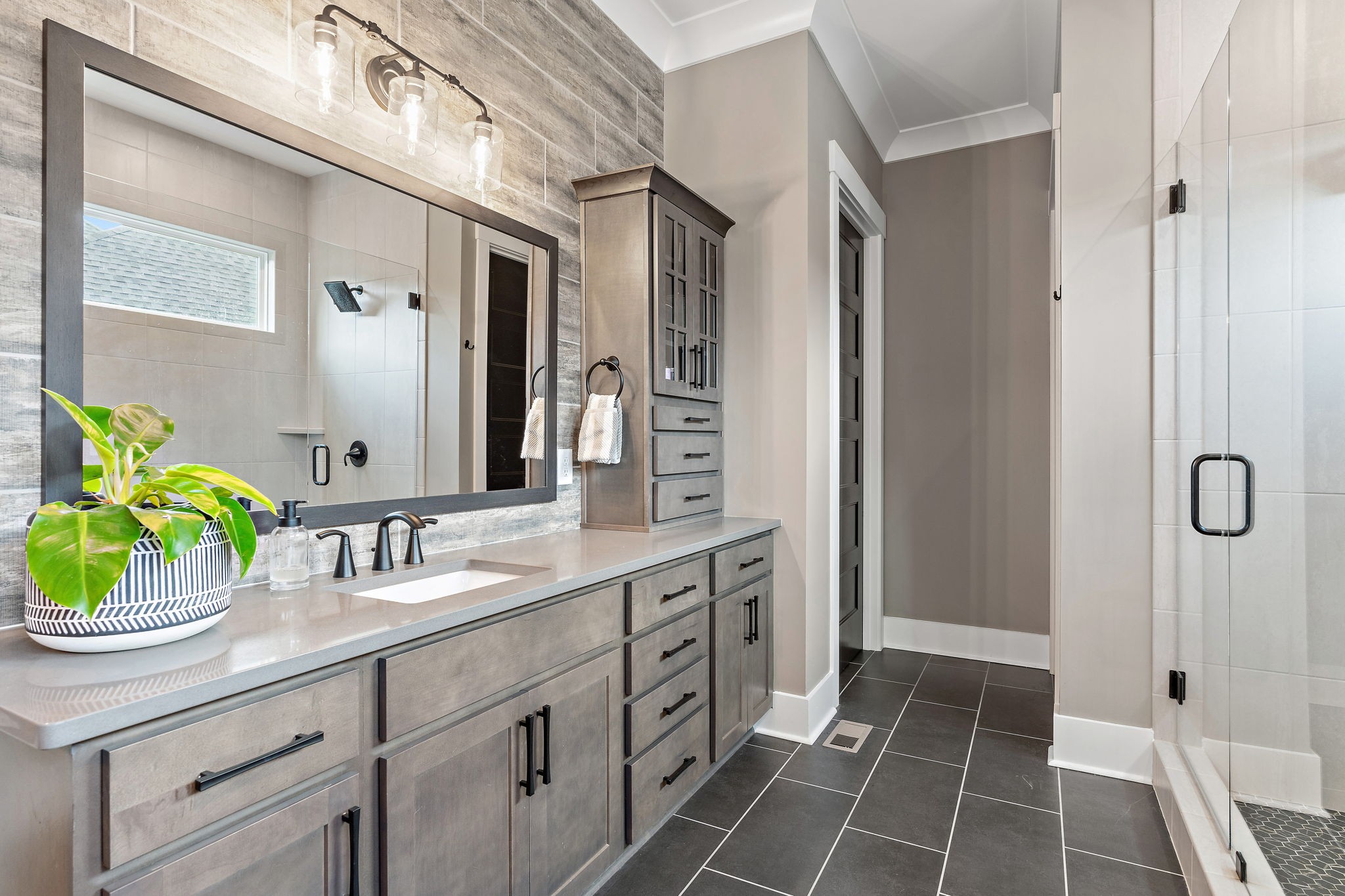 7276 Murrel Drive Franklin, TN 37064 - Photo 37 of 62 a spacious bathroom with a granite countertop sink a mirror and a shower