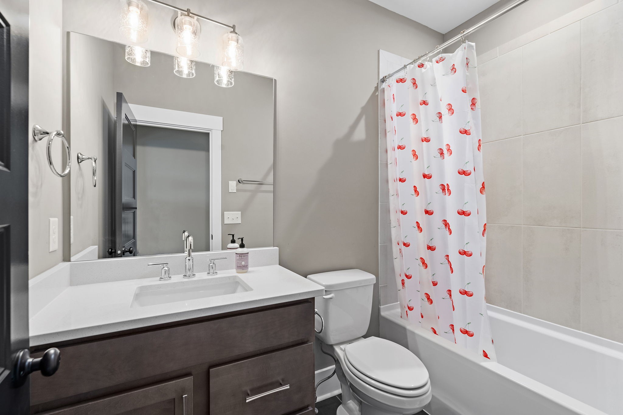 7276 Murrel Drive Franklin, TN 37064 - Photo 40 of 62 a bathroom with a sink a toilet a shower curtain and a mirror