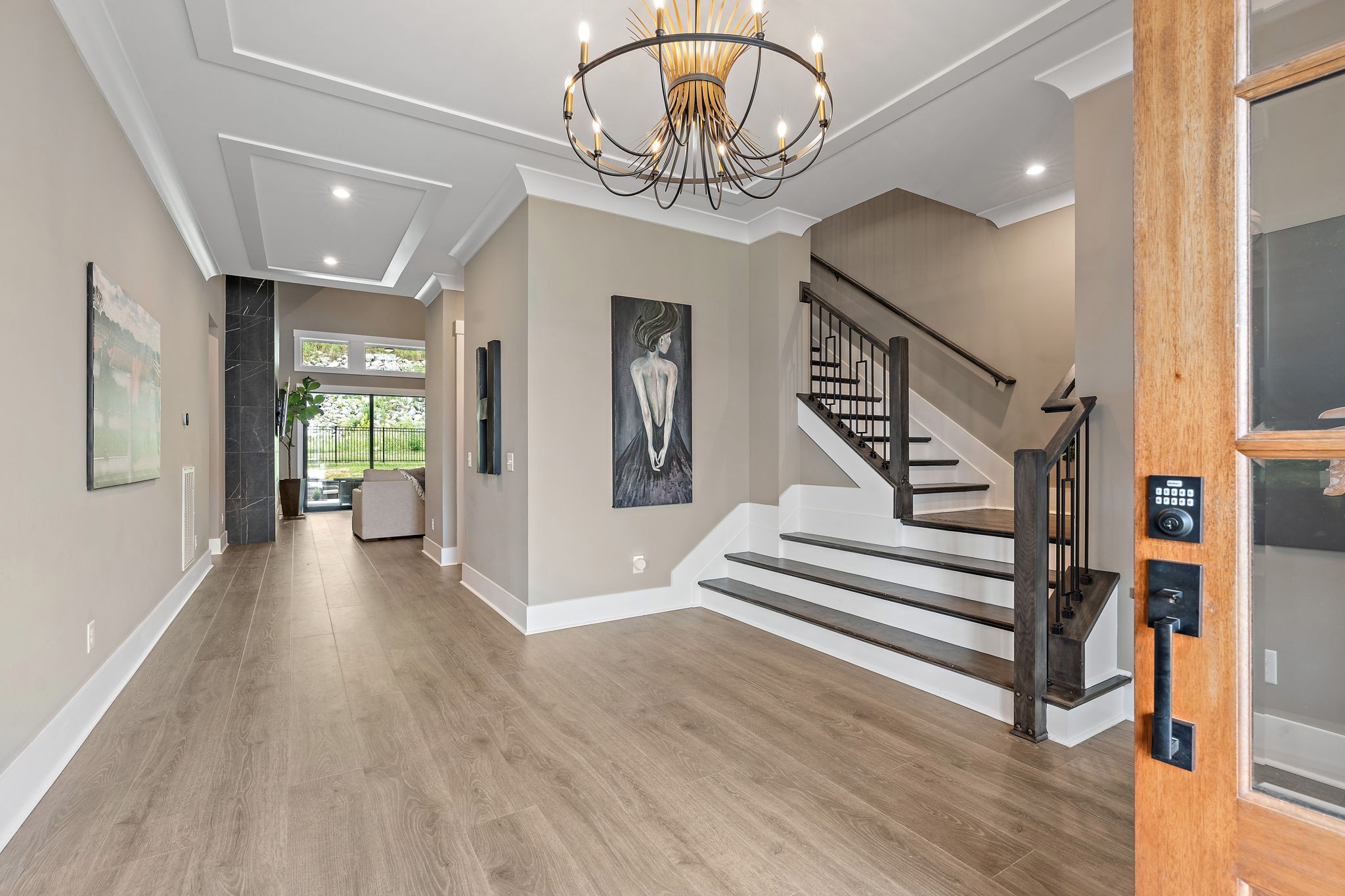 7276 Murrel Drive Franklin, TN 37064 - Photo 4 of 62 a view of a hallway with wooden floor and stairs