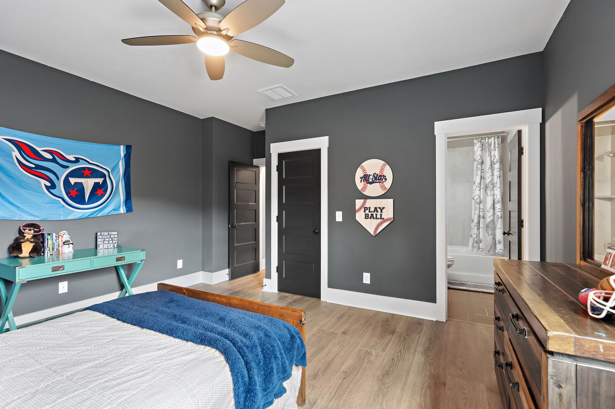 7276 Murrel Drive Franklin, TN 37064 - Photo 42 of 62 a bedroom with a bed and a chandelier