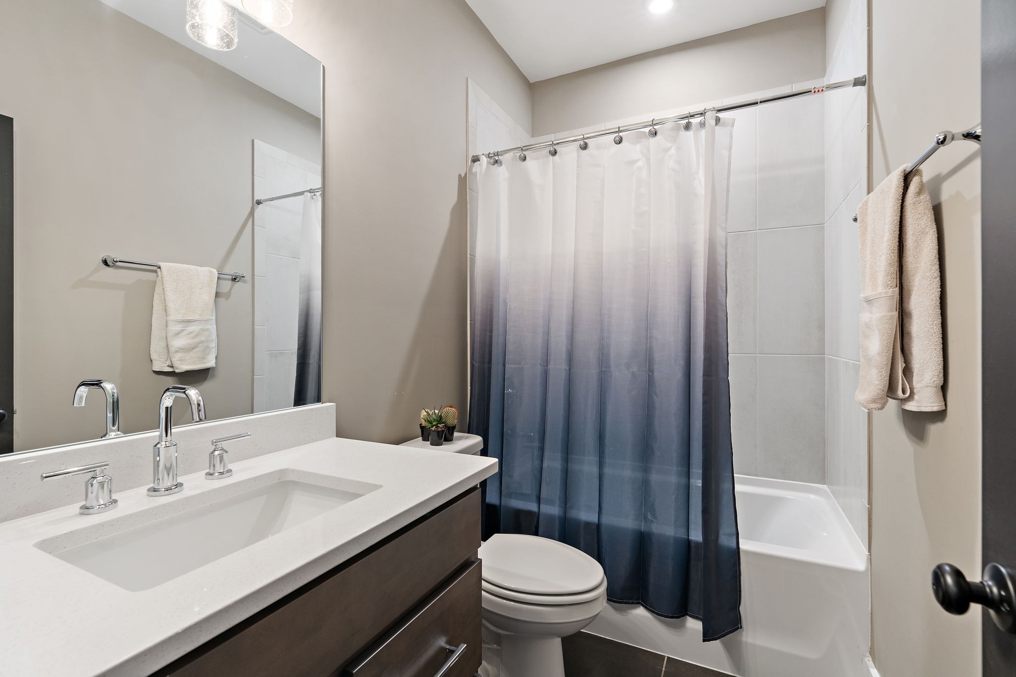 7276 Murrel Drive Franklin, TN 37064 - Photo 47 of 62 a bathroom with a sink a toilet and shower curtain