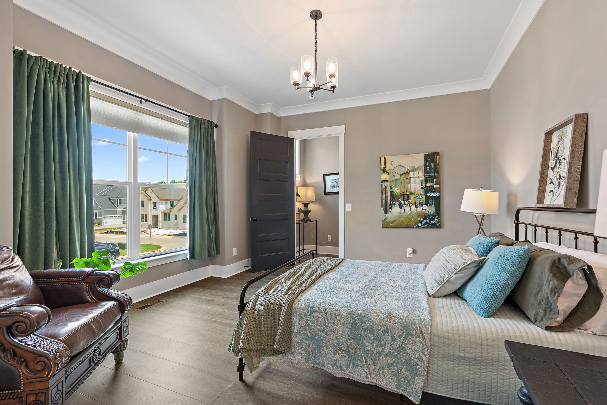 7276 Murrel Drive Franklin, TN 37064 - Photo 49 of 62 a bedroom with a balcony a bed and a couch