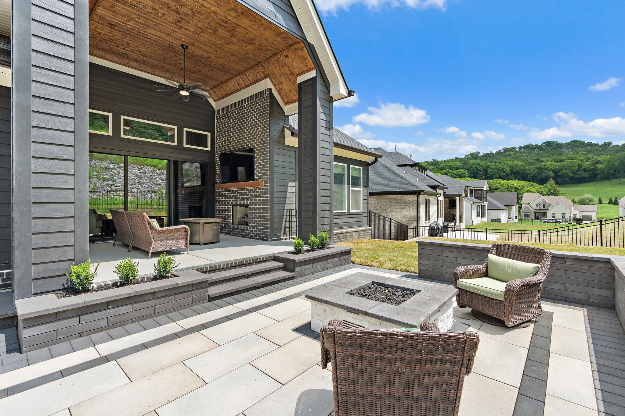 7276 Murrel Drive Franklin, TN 37064 - Photo 52 of 62 a view of a patio with couches table and chairs with wooden floor and fence