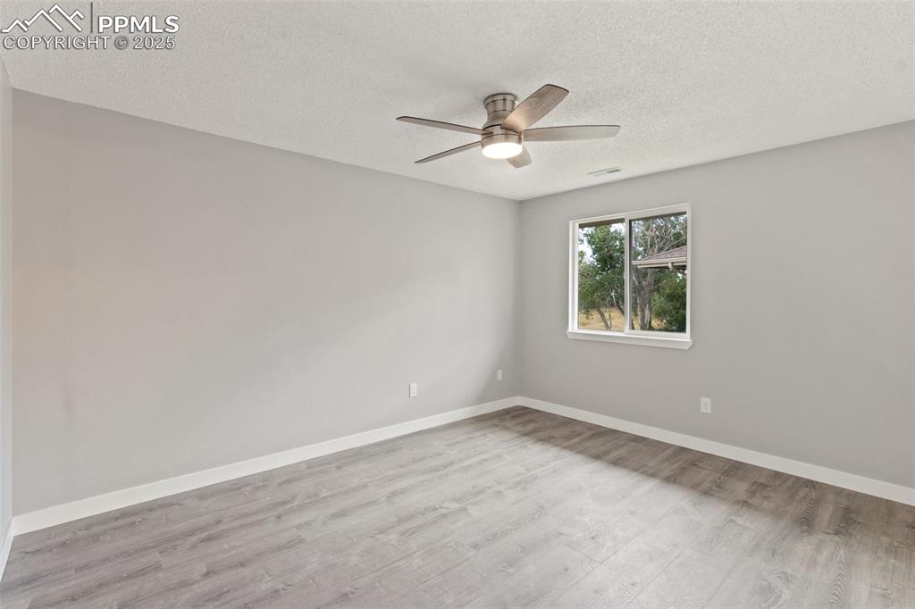 4435 Hunting Meadows Circle Colorado Springs, CO 80916 - Photo 11 of 15 Bedroom with ceiling fan