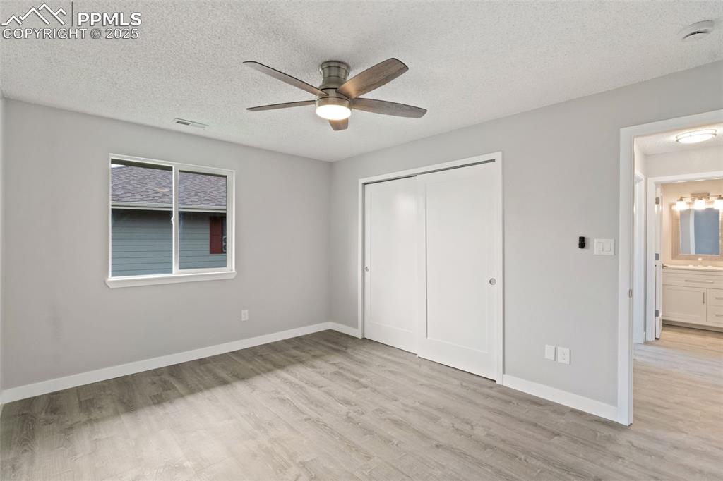4435 Hunting Meadows Circle Colorado Springs, CO 80916 - Photo 12 of 15 Bedroom with ceiling fan