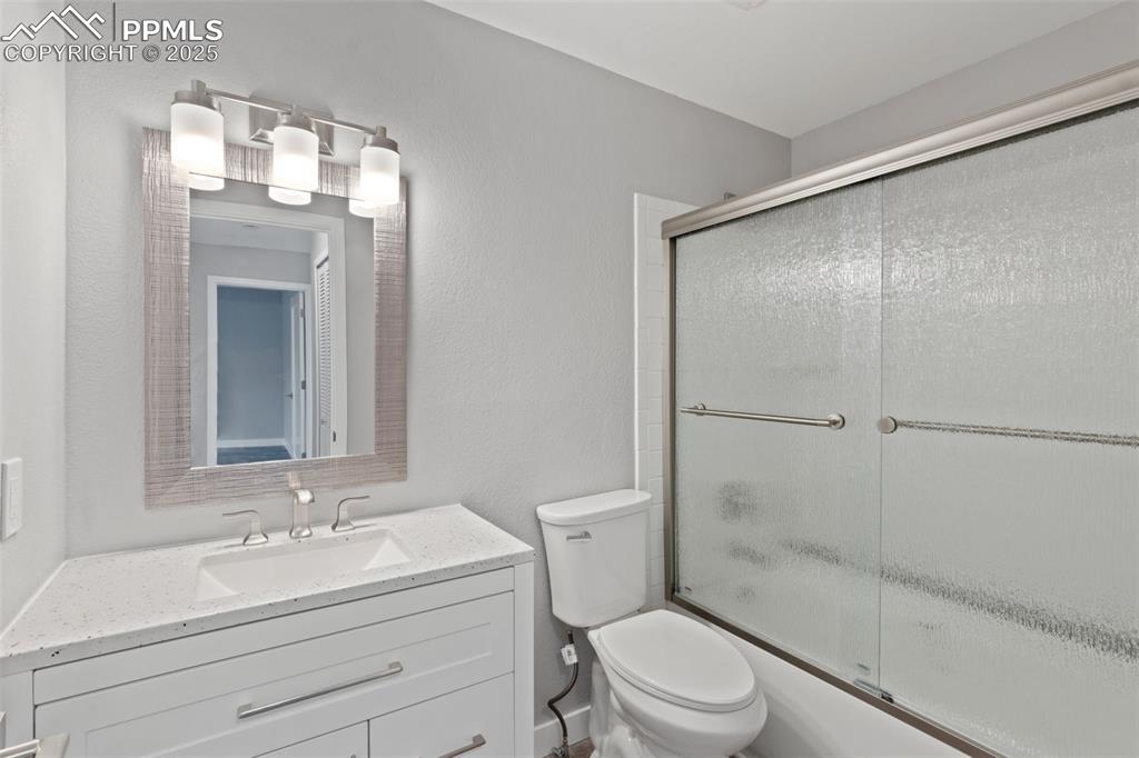 4435 Hunting Meadows Circle Colorado Springs, CO 80916 - Photo 14 of 15 Bright bathroom w/ step-in tub-shower