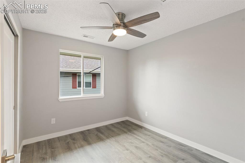 4435 Hunting Meadows Circle Colorado Springs, CO 80916 - Photo 9 of 15 Bedroom with ceiling fan