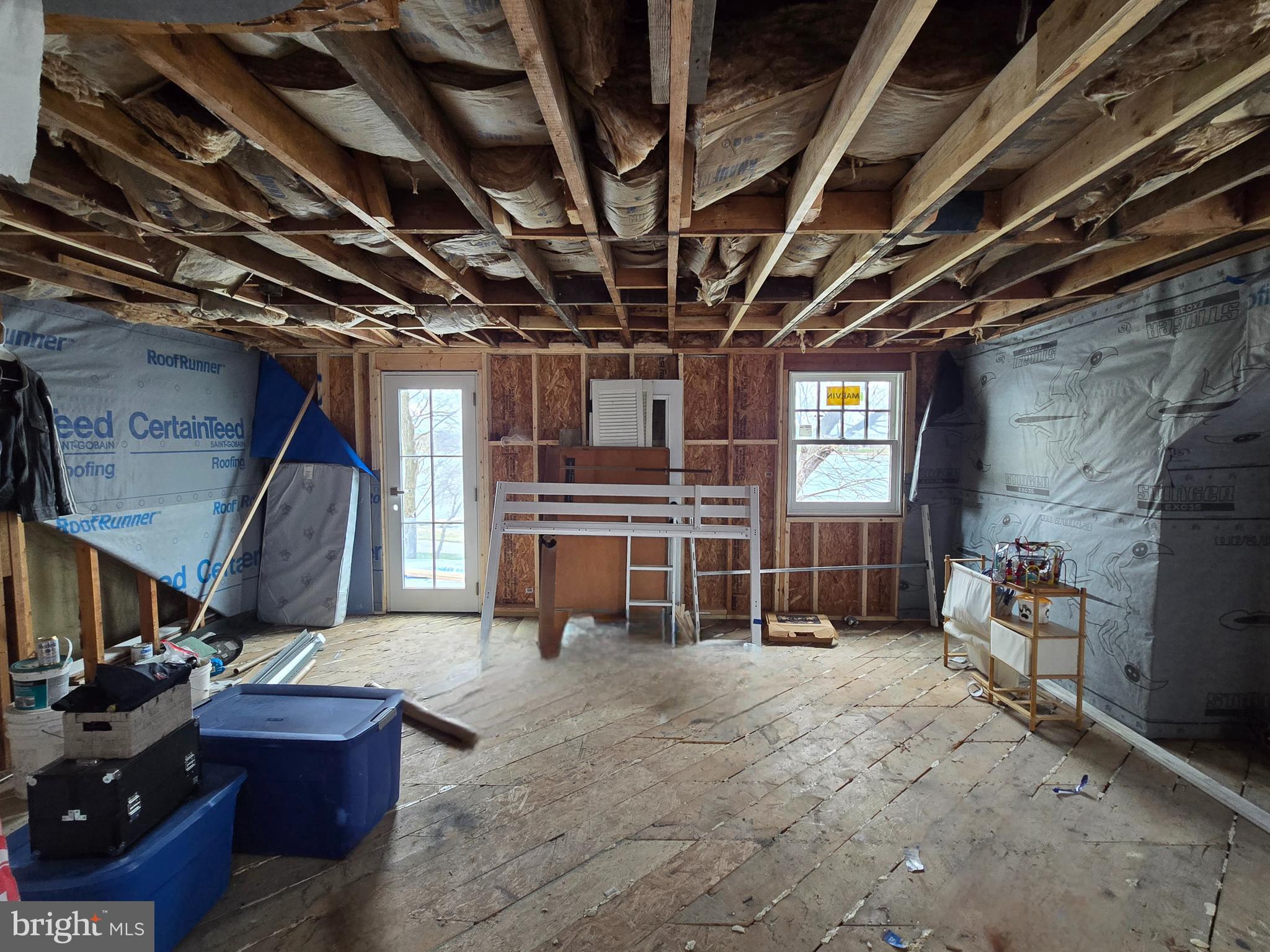 208 Harlem Road Pasadena, MD 21122 - Photo 11 of 24 a view of a storage room with wooden floor