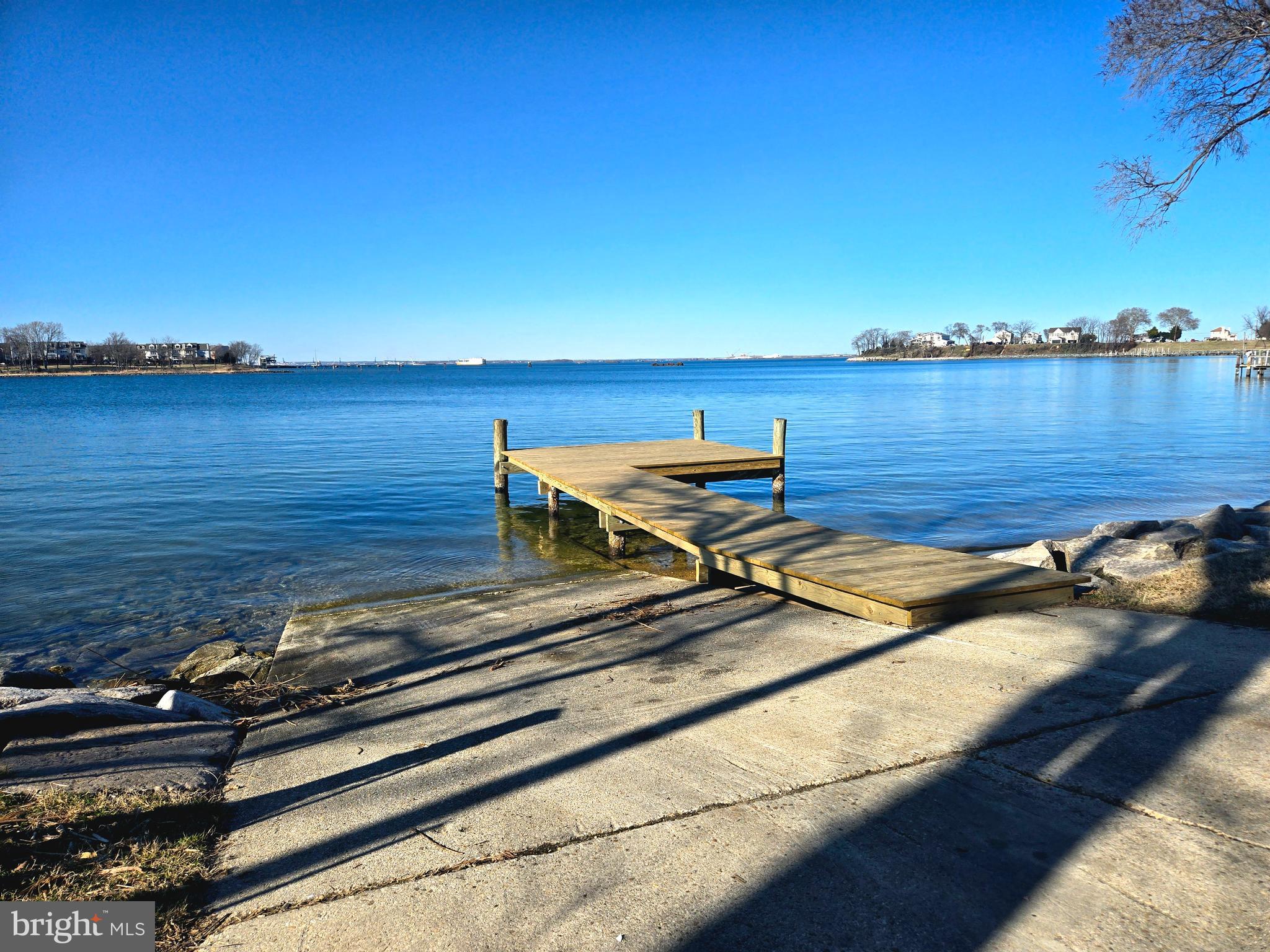 208 Harlem Road Pasadena, MD 21122 - Photo 20 of 24 a view of a ocean view with a bench