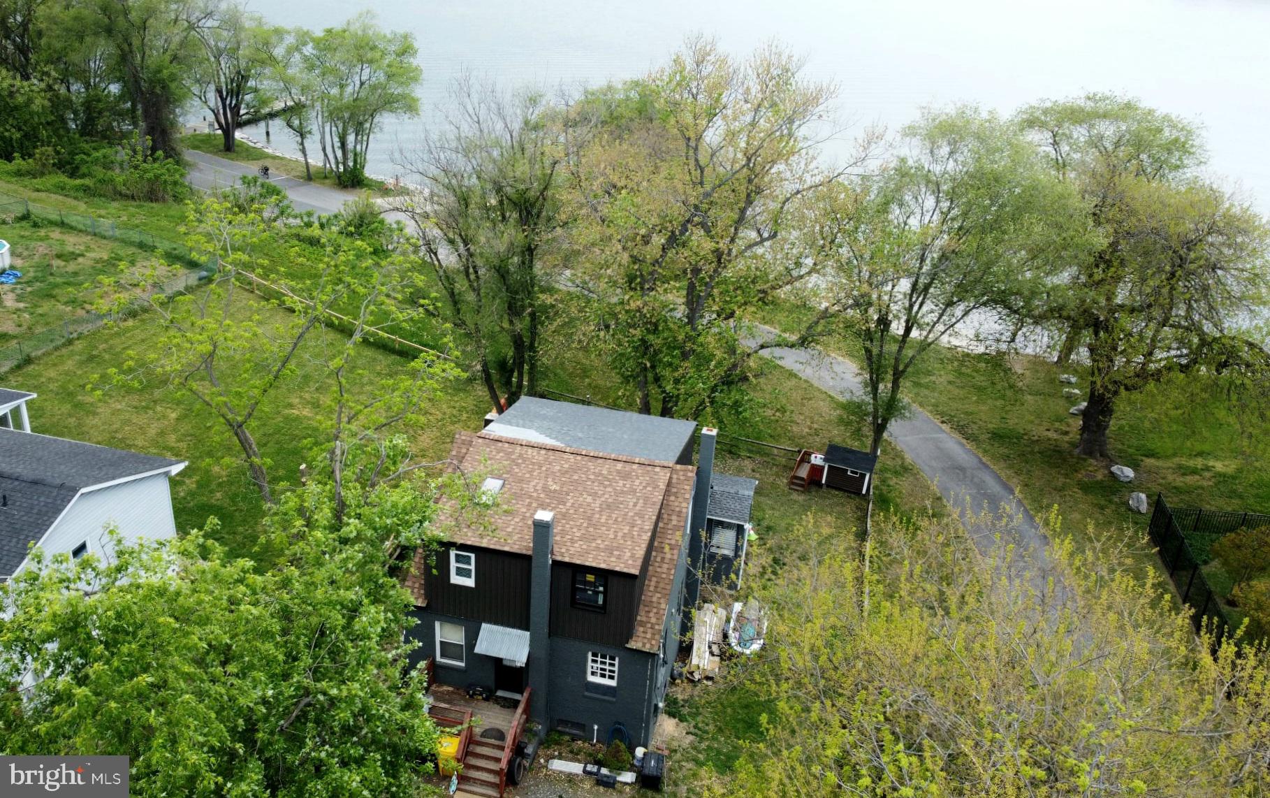 208 Harlem Road Pasadena, MD 21122 - Photo 3 of 24 an aerial view of a house with pool yard and outdoor seating