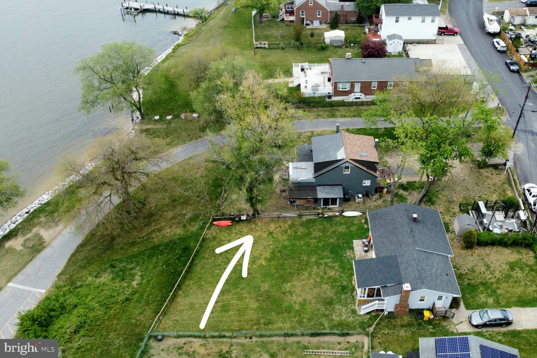 208 Harlem Road Pasadena, MD 21122 - Photo 5 of 24 an aerial view of a house with a garden