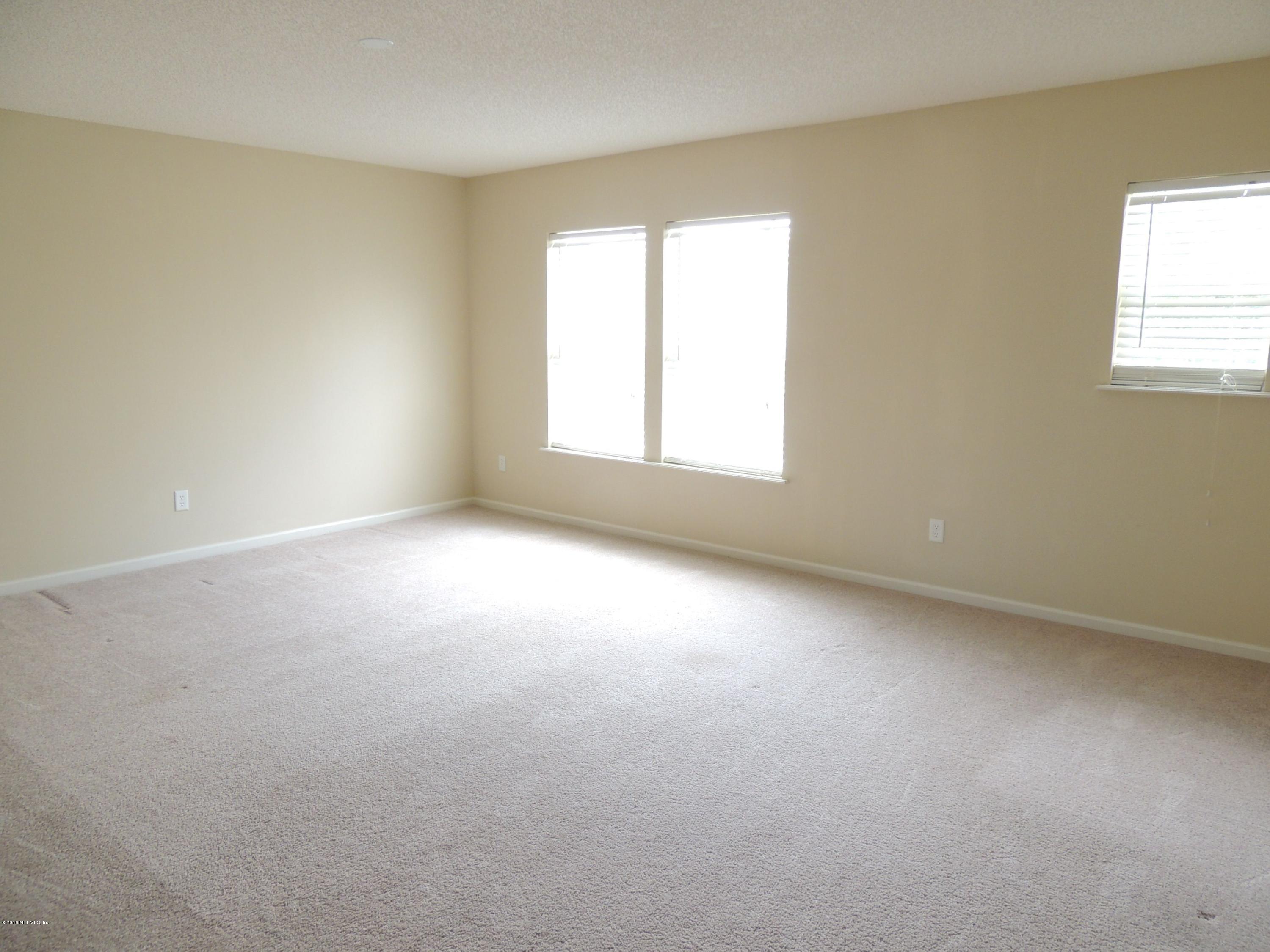 1179 Morning Light Road Jacksonville, FL 32218 - Photo 8 of 17 an empty room with a window