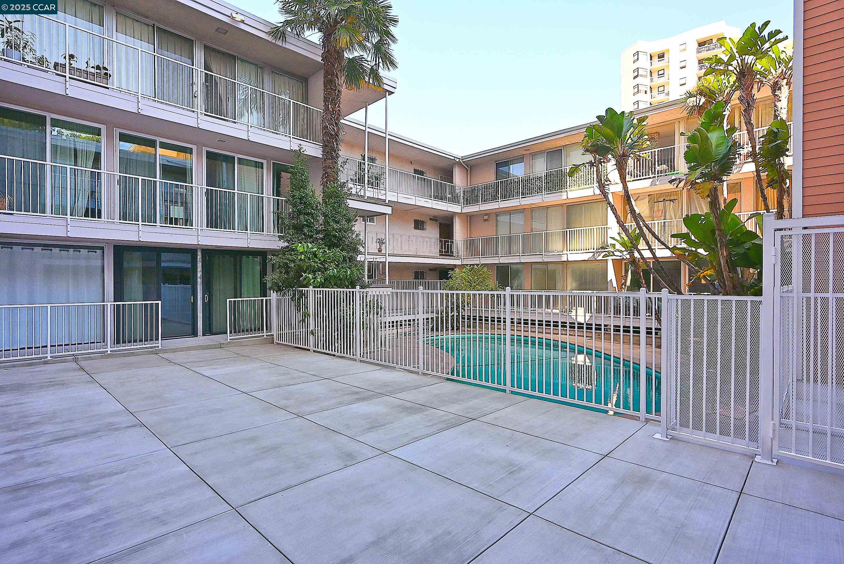 1425 Lakeside Drive, Unit 101 Oakland, CA 94612 - Photo 30 of 36 a view of a brick building next to a yard