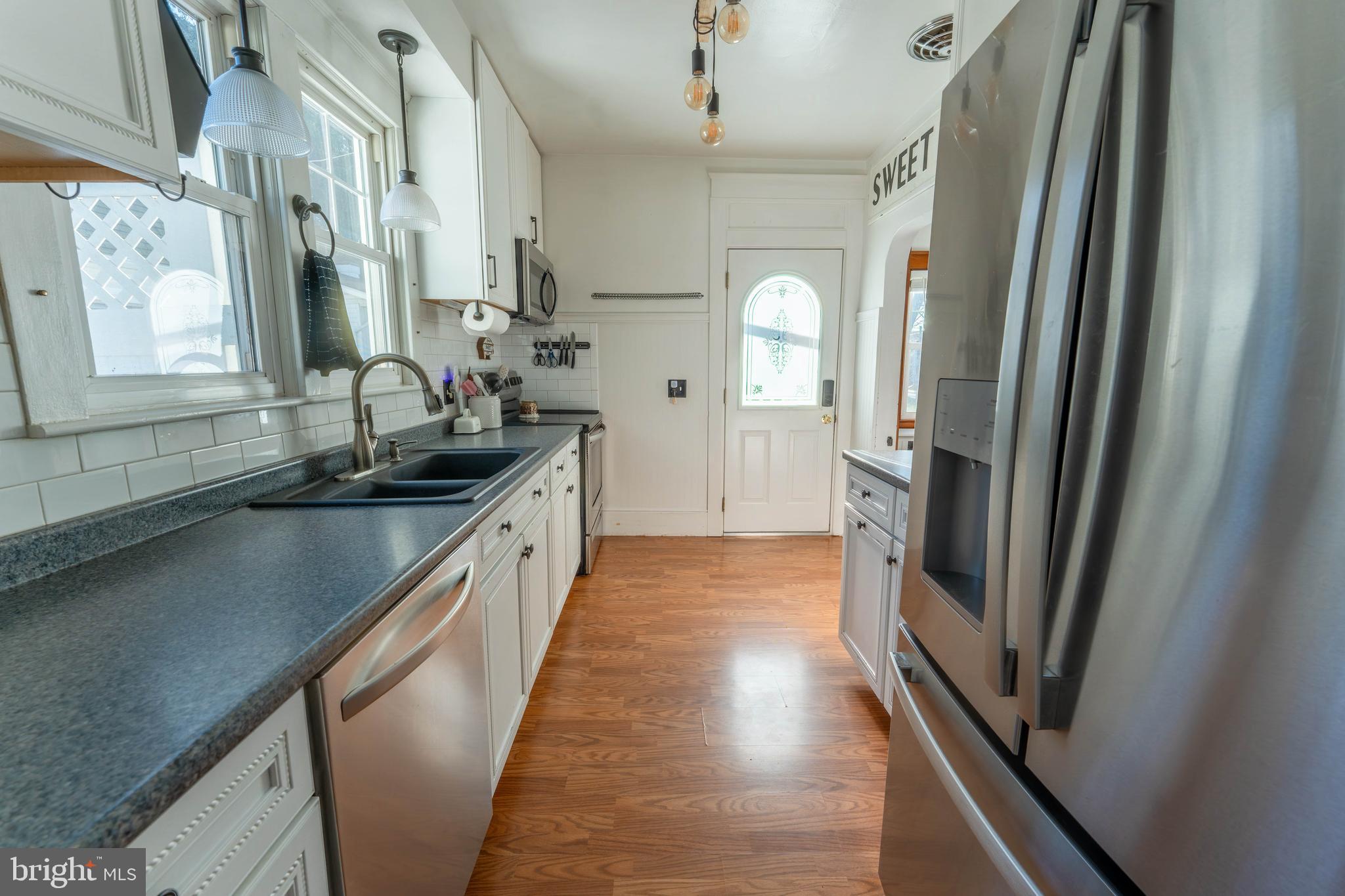 16 Main Street Felton, PA 17322 - Photo 15 of 34 a kitchen with stainless steel appliances granite countertop a refrigerator and a sink