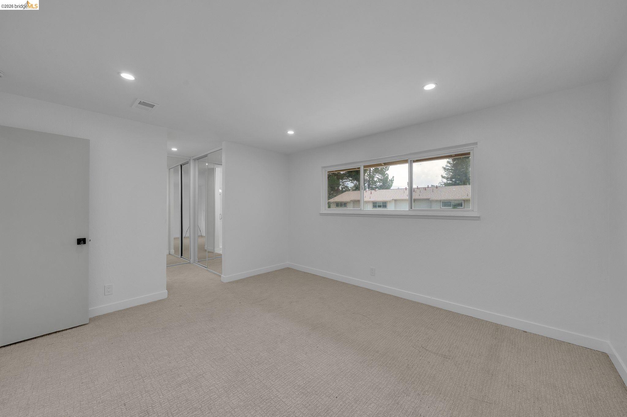 1808 Wildbrook Court, Unit D Concord, CA 94521 - Photo 32 of 47 a view of an empty room with a window