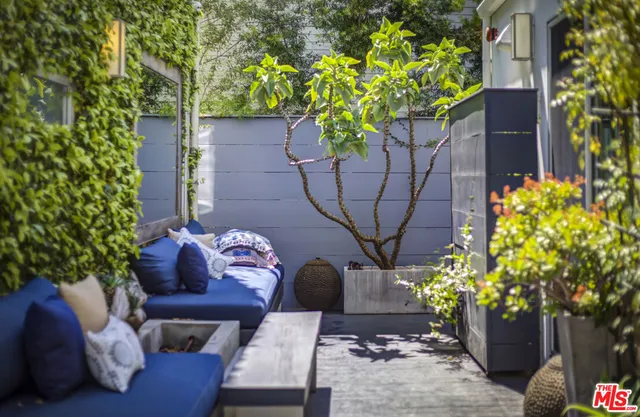 a wooden bench sitting in front of a building