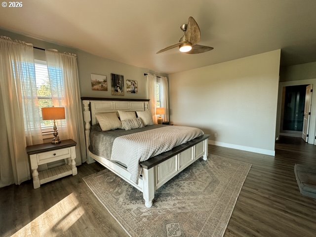 946 South Calapooia Street Sutherlin, OR 97479 - Photo 18 of 31 a bedroom with a bed and wooden floor
