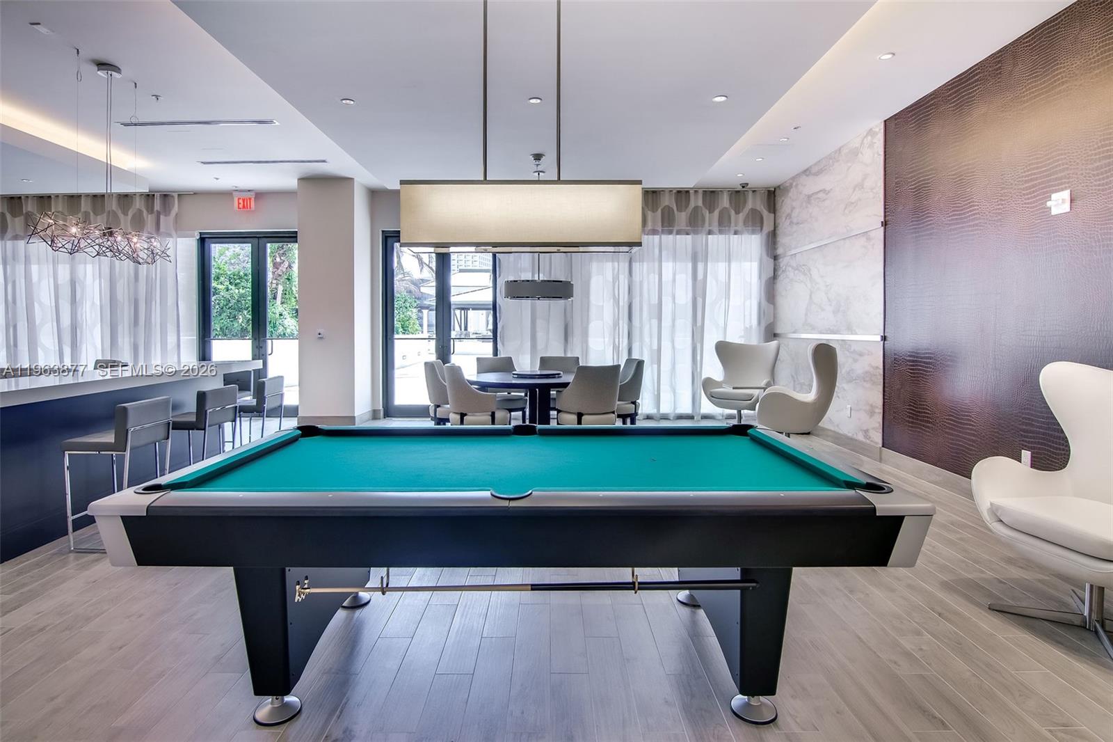 999 Southwest 1st Avenue, Unit 2303 Miami, FL 33130 - Photo 20 of 44 a room with pool table windows and furniture