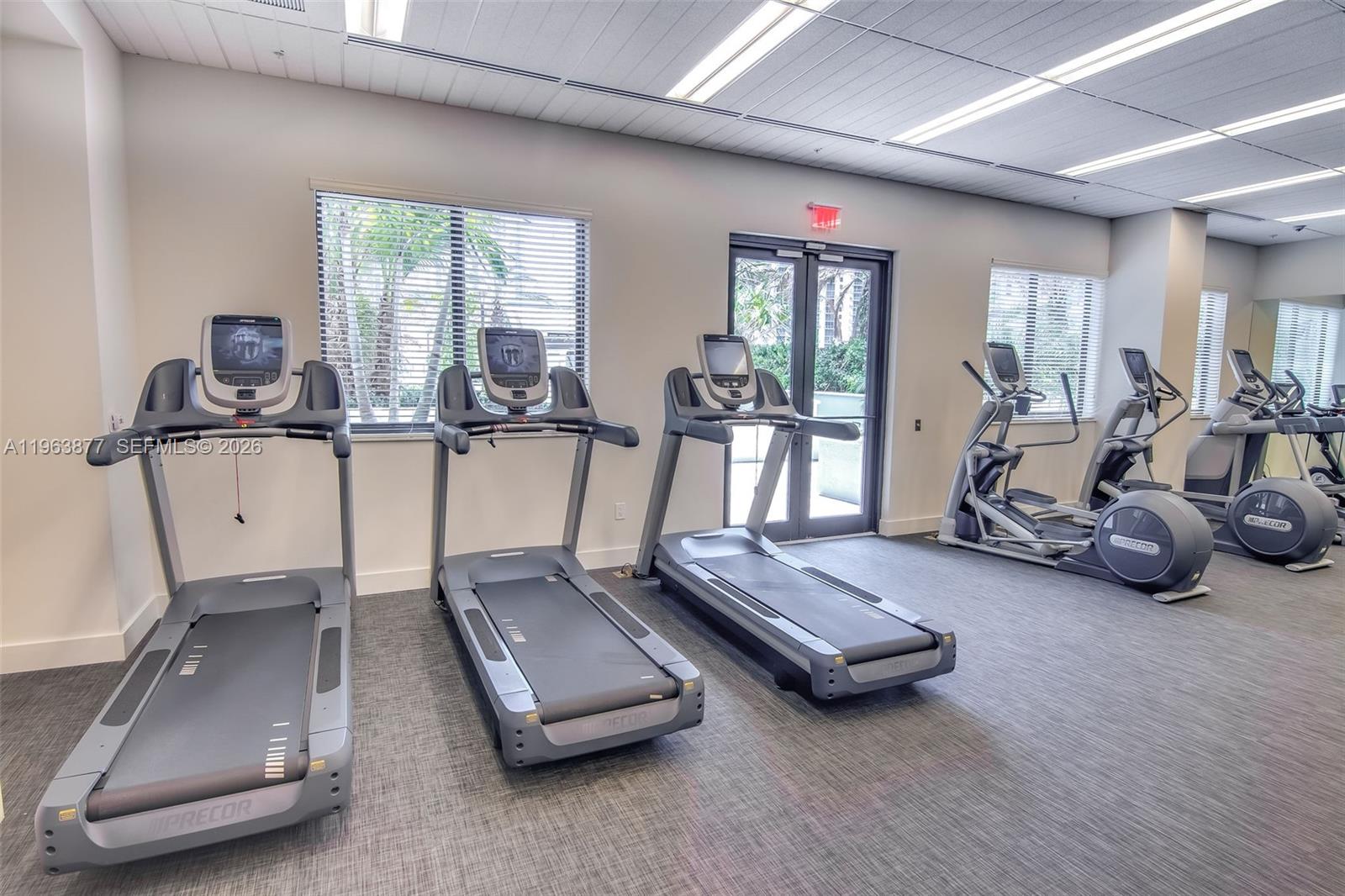 999 Southwest 1st Avenue, Unit 2303 Miami, FL 33130 - Photo 21 of 44 a room with gym equipment