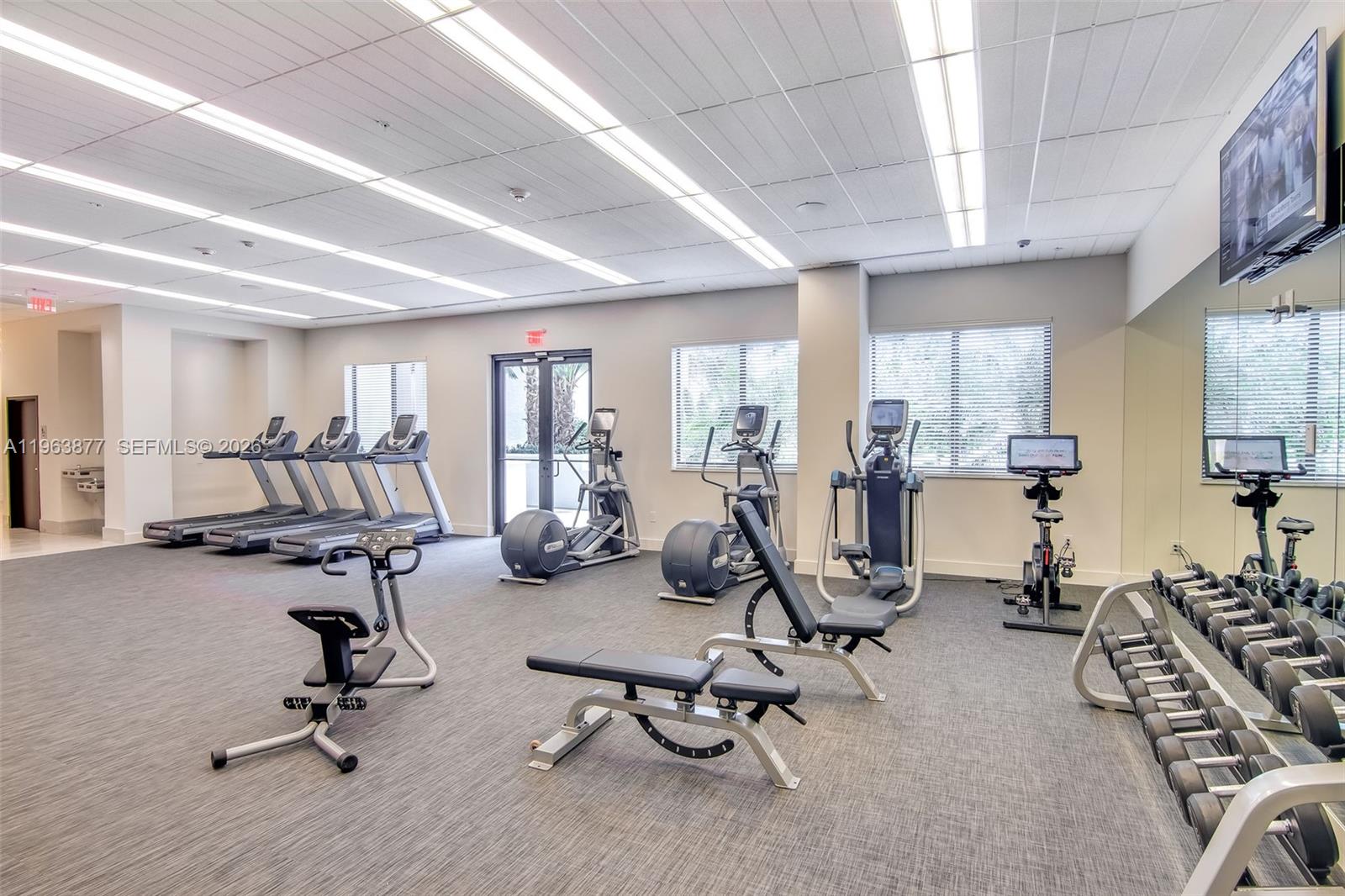 999 Southwest 1st Avenue, Unit 2303 Miami, FL 33130 - Photo 23 of 44 a view of a room with gym equipment