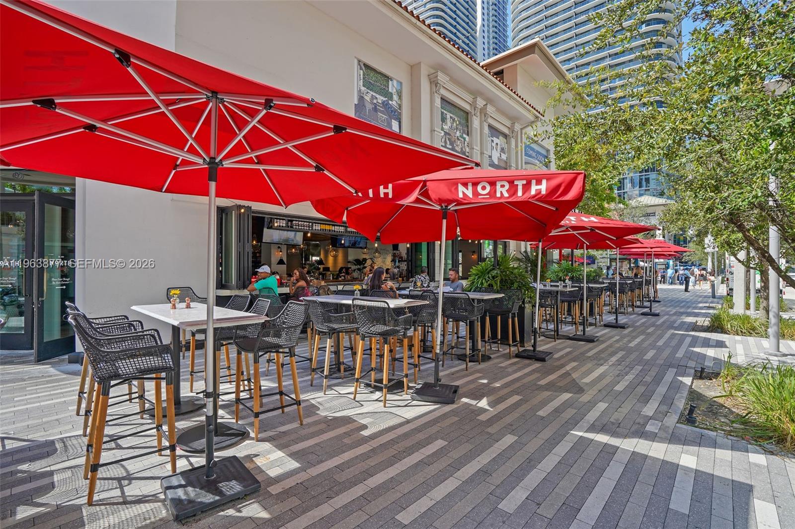 999 Southwest 1st Avenue, Unit 2303 Miami, FL 33130 - Photo 40 of 44 a view of a cafe with sitting area
