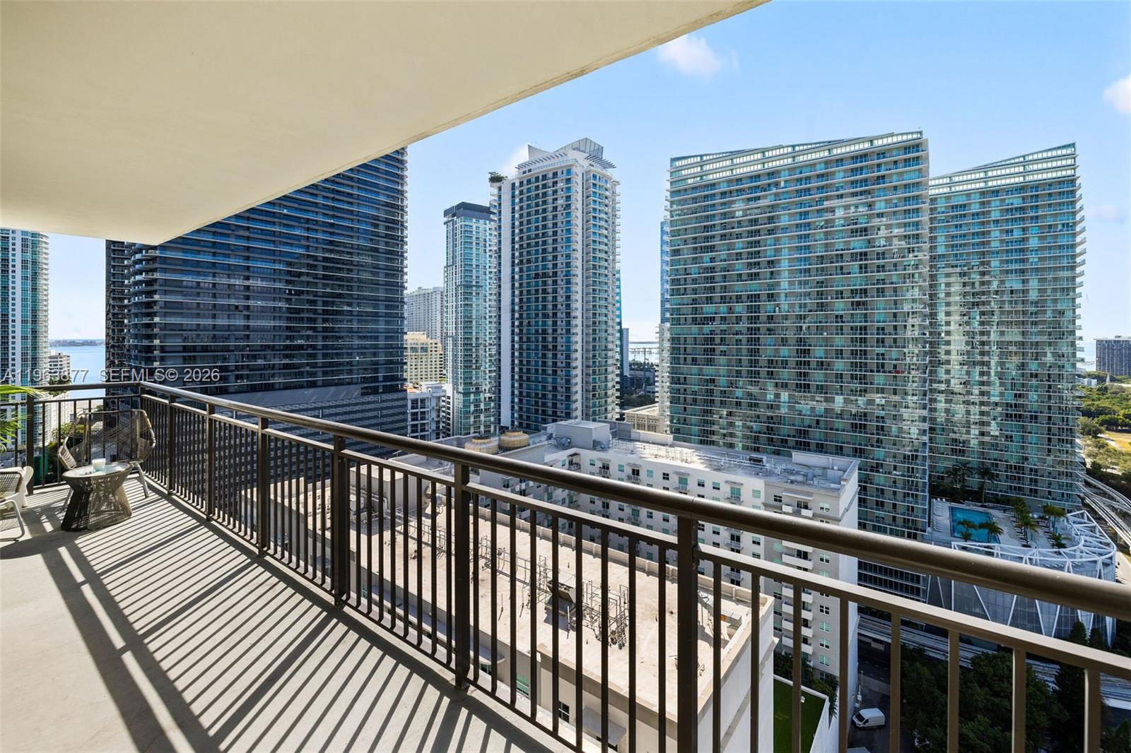 999 Southwest 1st Avenue, Unit 2303 Miami, FL 33130 - Photo 7 of 44 a view of balcony with wooden floor and fence