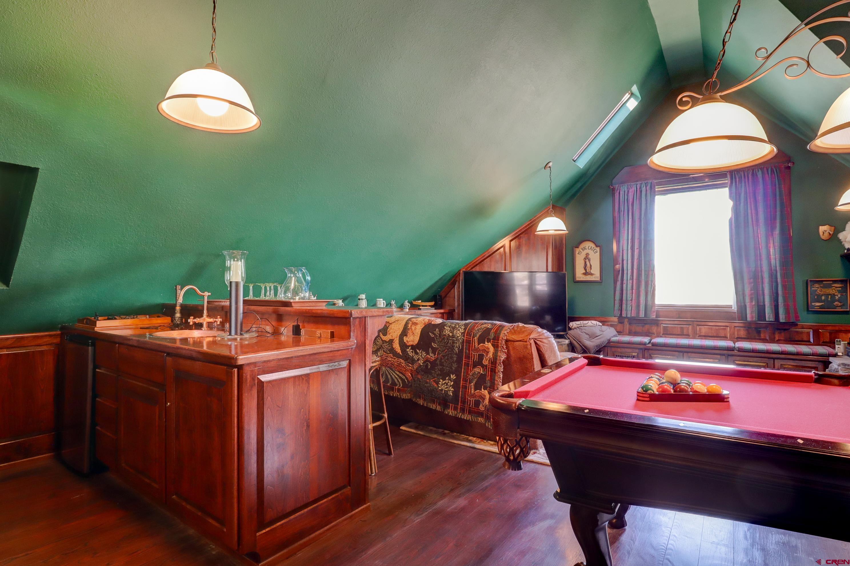 18656 Highway 145 Dolores, CO 81323 - Photo 13 of 45 Recreation room with lofted ceiling, billiards, dark wood-style flooring, and a sink