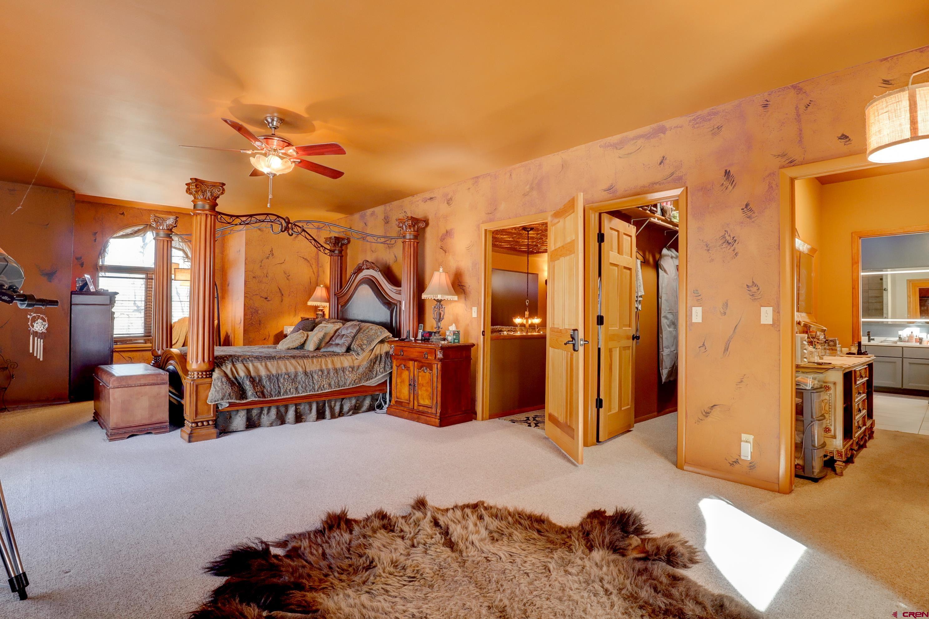 18656 Highway 145 Dolores, CO 81323 - Photo 22 of 45 Carpeted bedroom featuring a walk in closet